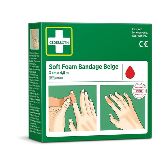 Eine grüne Schachtel von Orkla Wound Care AB Cederroth soft foam binde beige 3x450cm (1 Stück) zeigt eine illustrierte Anleitung zum Fingerwickeln, ein weißes Kreuz und Produktdetails auf der Verpackung.