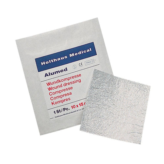Das Holthaus Medical Alumed® Wundkompresse Paket der Holthaus Medical GmbH & Co. KG zeigt in mehreren Sprachen eine Wundauflage mit Aluminiumnetz. Es misst 10 x 10 cm und enthält ein einzelnes steriles Stück (1 Stück).