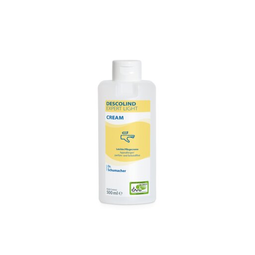 Bouteille blanche de 500 ml de crème pour les mains Dr. Schumacher DESCOLIND EXPERT LIGHT CREAM de Dr. Schumacher GmbH, avec une étiquette jaune contenant des informations sur le produit en allemand, un logo vert en bas à droite et la mention pour le soin des peaux sensibles.