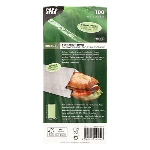 A 100-pack of PAPSTAR greaseproof sandwich bags (21x10x3 cm, white) from PAPSTAR GmbH comes in shrink-wrapped packaging with printed product details and shows a sandwich inside the greaseproof white bags.