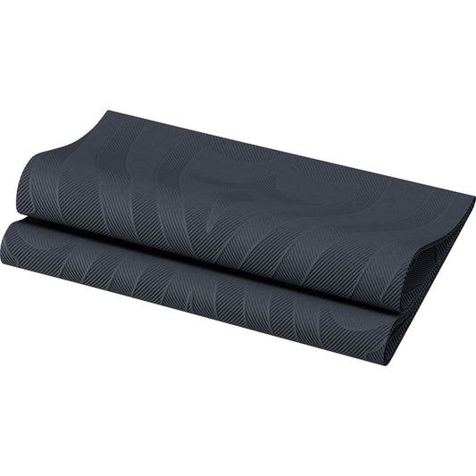 Eine gefaltete schwarze Yogamatte mit subtilen Wellenlinien vor weißem Hintergrund erinnert an die moderne Eleganz der Elegance Servietten 40x40 cm der Duni GmbH in Schwarz mit stilvollem Lilienmuster - ideal für schicke Tische.