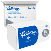 A box of Kleenex® folded hand towels from Kimberly-Clark GmbH (white, center-folded) contains 15 packs of 186 sheets each—for a total of 2,790 disposable hand towels. Blue and white branding; an open shipping carton is visible in the background.