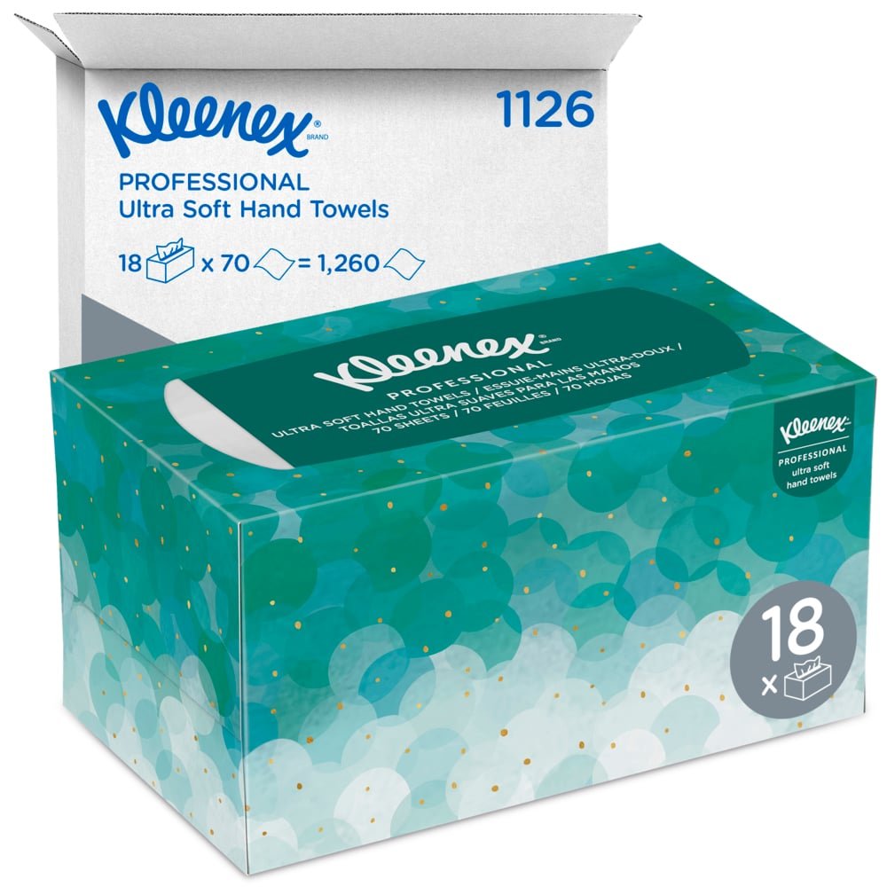 Une boîte de mouchoirs Kleenex® Ultra™ Interfold (blanc, moyen, 70 pièces) de la société Kimberly-Clark GmbH est représentée devant un carton d'expédition blanc avec l'inscription "1126" et "18 x 70 = 1.260", contenant 18 paquets hygiéniques.