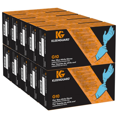 Zwölf Schachteln KleenGuard® G10 FleX Nitril-Handschuhe (24 cm, beidhändig tragbar) von Kimberly-Clark GmbH sind in drei Reihen gestapelt. Die orange-schwarze Verpackung zeigt eine Hand mit blauen Handschuhen und Produktangaben.