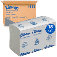 The image shows a bulk package of Kleenex® Ultra™ MultiFold paper towels in white, small size, 18 clips x 150 sheets, manufactured by Kimberly-Clark GmbH: a packaged box in front of a cardboard box displaying product information and the specifications for the MultiFold paper towels.