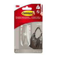 The packaging for the Command™ Medium Designer Hook in a metallic finish (17081BN) from 3M Deutschland GmbH shows a sturdy hook holding a handbag. According to the packaging, it can hold up to 1.3 kg and can be removed cleanly without leaving any marks.
