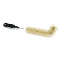 The Nölle Profi Brush Radiator Brush (L-shape), 39 cm, with pure bristles from Nölle Profi Brush Bürsten- & Pinseltechnik e.K., features stiff bristles, a twisted metal handle, and a black plastic handle with a hanging hole—perfect for cleaning radiators.