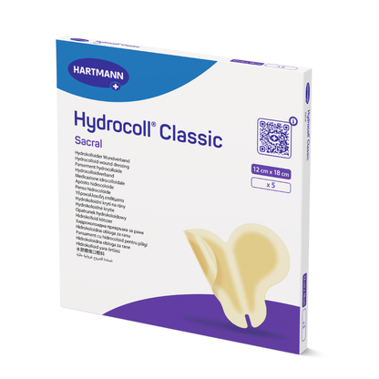 Una confezione di Hartmann Hydrocoll Classic Sacral sterile sigillata singolarmente 12 x 18 cm della Paul Hartmann AG contiene 5 medicazioni per la cura umida delle ferite. La confezione include dettagli del prodotto e un'immagine del bendaggio.