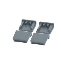 A gray plastic Protect Trolley cover cap from Diversey Deutschland GmbH & Co. OHG, designed to cover trolley mounting points, is shown against a white background. The package contains 1 piece with open sides and internal ribs for a secure fit.