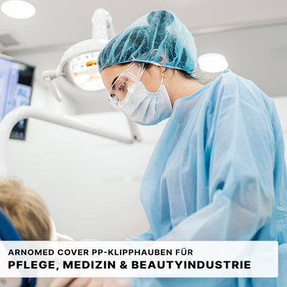 A healthcare worker in blue PPE examines a patient, with medical equipment nearby. The text advertises the ARNOMED COVER PP-CLIP CAP XL (55cm, PP fleece) from ARNOWA GmbH - the ideal disposable clip cap for the care, medical, and cosmetic industries.