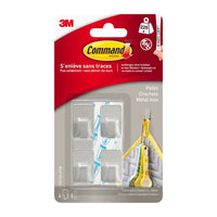 Le kit de crochets métalliques en acier inoxydable Command™ taille S, référence 17031SS-4ES, de 3M Deutschland GmbH, comprend 4 crochets autocollants et 5 bandes adhésives ; il permet d'organiser vos murs sans les abîmer et s'enlève facilement. L'emballage comporte des textes en français ainsi que des illustrations d'utilisation.