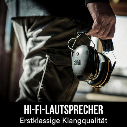 A person holds a black 3M™ WorkTunes™ Connect Hearing Protector 90543E Bluetooth® (SNR 31 dB) from 3M Deutschland GmbH. The text below reads in German "HI-FI SPEAKERS Premium Sound Quality".
