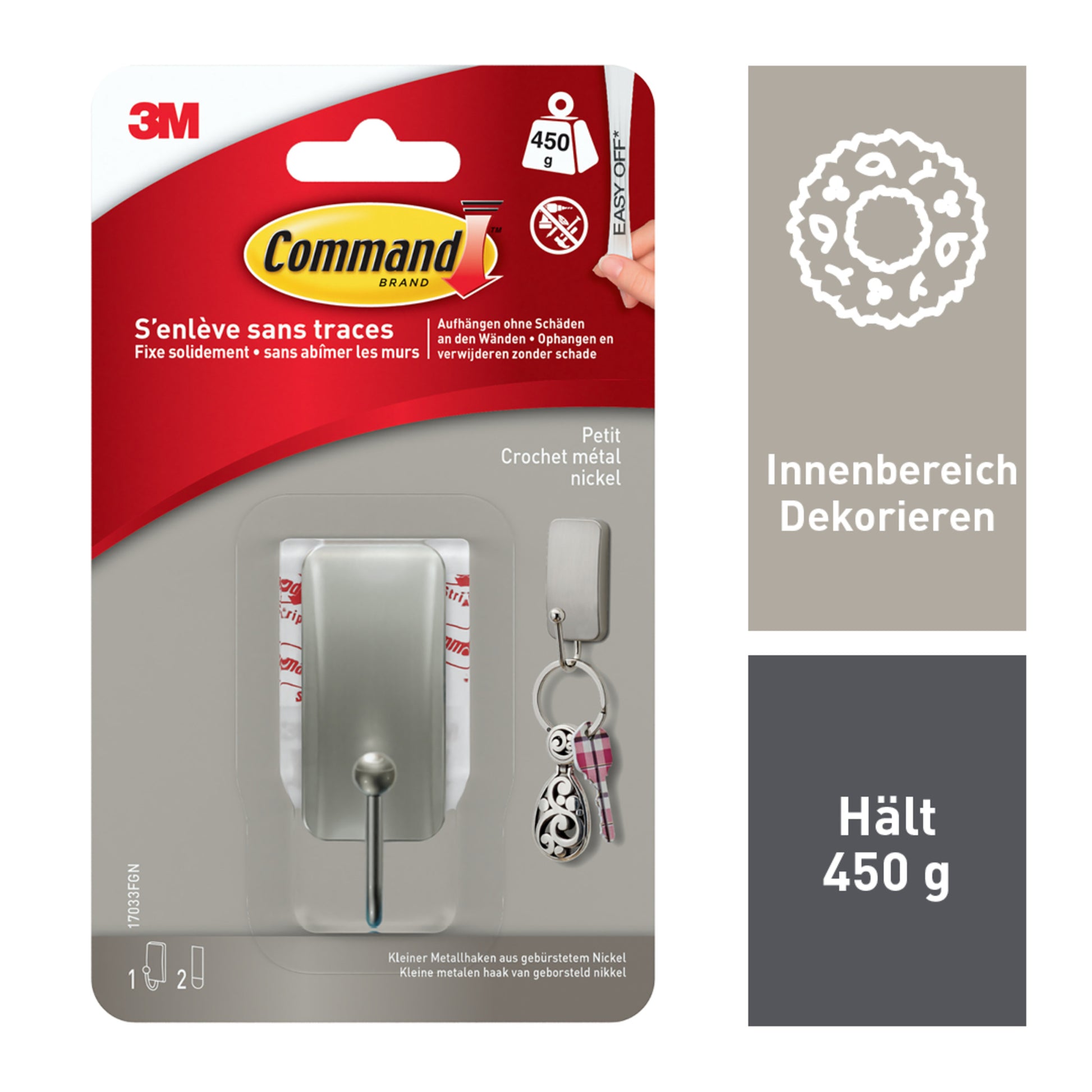 Ein 3M Command™ Metallhaken in gebürstetem Nickel (1 Haken, 2 Streifen) von 3M Deutschland GmbH hält bis zu 450 g. Die Packung zeigt Produktbilder, Kapazitätsdetails und mehrsprachigen Text auf Französisch und Deutsch.