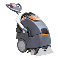 The TASKI procarpet 45 spray-extraction and encapsulation machine from Diversey Deutschland GmbH & Co. OHG stands out with its gray/orange design, large wheels, push handle, hoses, transparent tank lid, and wide cleaning nozzle at the front.