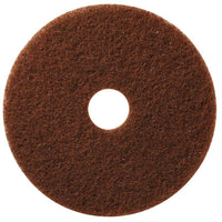 The TASKI Americo Pad Brown from Diversey Deutschland GmbH & Co. OHG is a round, brown, textured deep-cleaning pad with a center hole designed for aggressive cleaning of stubborn dirt, shown against a white background.