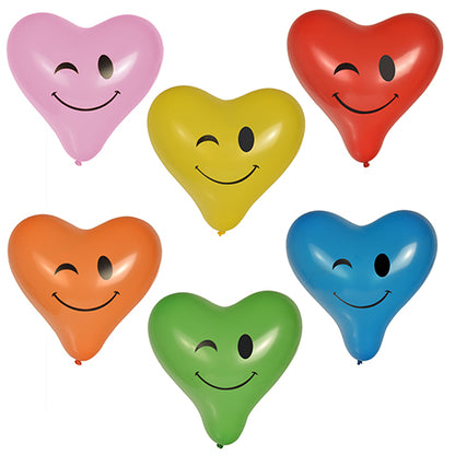 Les six PAPSTAR ballons "Heart - Blinky" (Ø 28 cm, assortis en couleurs) de PAPSTAR GmbH sont disposés en deux rangées de trois et montrent chacun un visage souriant et clignant de l'œil dans les couleurs rose, jaune, rouge, orange, vert et bleu.
