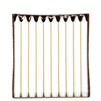 A box of 30 white PAPSTAR Crown Candles, taper candles (Ø 2.2 cm, 100% stearin) from the PAPSTAR GmbH, arranged in a straight line and viewed from above against a plain white background to ensure even burn.