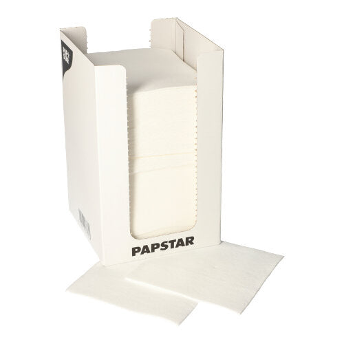 A white cardboard dispenser with the inscription "PAPSTAR GmbH" contains a stack of PAPSTAR 100 napkins, 2-ply "PUNTO" 1/4-fold, 20x20 cm; two napkins are partially pulled out and placed in front of the box.