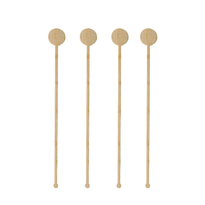 Quatre PAPSTAR 100 mélangeurs de boissons en bambou « pur » de la marque PAPSTAR GmbH avec des têtes rondes et plates sont disposés verticalement en ligne sur un fond blanc.