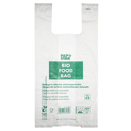 The 100 shirt carrier bags of PAPSTAR GmbH are transparent, biodegradable bio-film knot bags on a roll with green "PAP STAR BIO FOOD BAG" text and multilingual information about compostability and renewable raw materials.