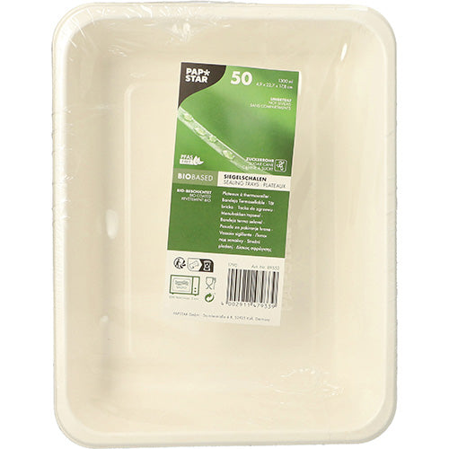 A rectangular, white, biodegradable PAPSTAR 50 sealable sugarcane plate (PLA coated, 4.9 x 22.7 x 17.8 cm) from PAPSTAR GmbH, with a green and white middle label with product information, packaged in clear plastic wrap.