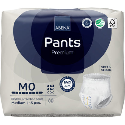 Un pack de 15 ABENA Pants Premium M de Abena Re-Seller GmbH se distingue par une haute capacité d'absorption, des propriétés "douces et sûres" et "respectueuses de la peau", avec des symboles de produit et de durabilité sur l'emballage.