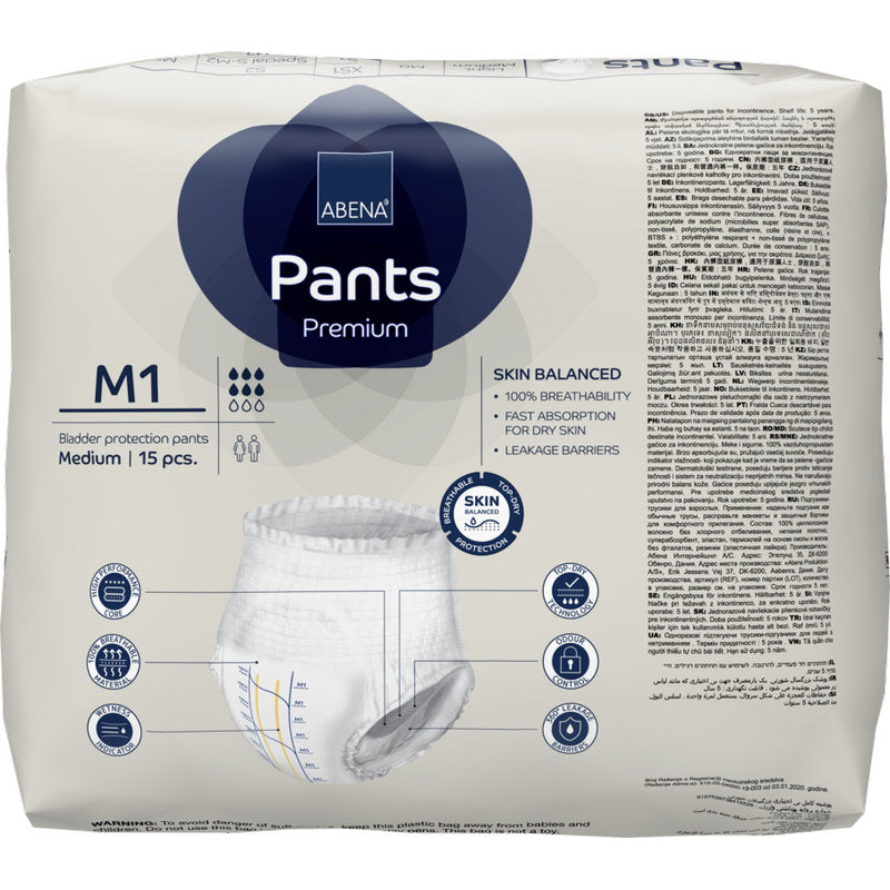 Un paquet de ABENA Pants Premium M de Abena Re-Seller GmbH, taille moyenne, contient 15 pièces. L'emballage contient des symboles et des textes pour une haute capacité d'absorption, respirabilité, absorption et équilibre cutané.