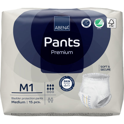 Un paquet de 15 ABENA Pants Premium M de Abena Re-Seller GmbH est livré dans un emballage principalement blanc avec des accents bleus, des images de produit et des logos de certification, mettant en avant la protection premium de la vessie.