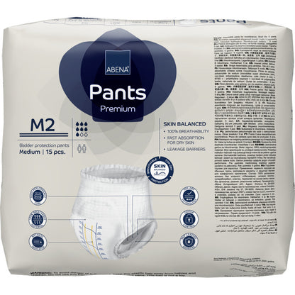 Un paquet de 15 ABENA Pants Premium M de Abena Re-Seller GmbH, pantalons jetables de taille moyenne avec une haute capacité d'absorption. L'emballage montre des détails de produit, des icônes et des images en plusieurs langues.