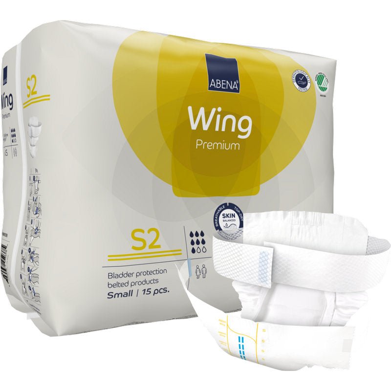 Un paquet de 15 couches-ceintures ABENA Wing Premium S2 pour adultes de Abena Re-Seller GmbH. L'emballage jaune et blanc montre des informations sur le produit, une couche dépliée à l'avant et met en avant la protection et le confort en tant que produits d'incontinence éprouvés.