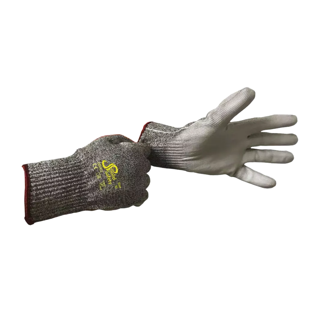A person is wearing an AMPri SolidSafety Cut High cut-resistant glove made of cut-resistant materials on the left hand, while the right hand is holding the cuff of a second glove. These gray gloves from AMPri Handelsgesellschaft mbH are made of HPPE yarn with a yellow logo on the back, a ribbed texture, and a red cuff at the wrist.
