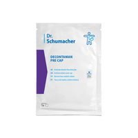 La cuffia da bagno Dr. Schumacher Decontaman Pre Cap | Confezione (1 cuffia) della Dr. Schumacher GmbH è contenuta in una confezione bianca con scritte blu/viola e informazioni multilingue: perfetta per la pulizia antimicrobica con la cuffia da bagno DECONTAMAN CAP.