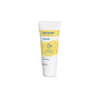 Un tube blanc de 100 ml de la crème de soin Dr. Schumacher Descolind Pure Light Cream pour peaux sensibles, orné de touches de jaune et de bleu et portant le logo de la société Dr. Schumacher GmbH, est représenté debout sur un fond blanc sobre. Idéal pour les professionnels de santé.