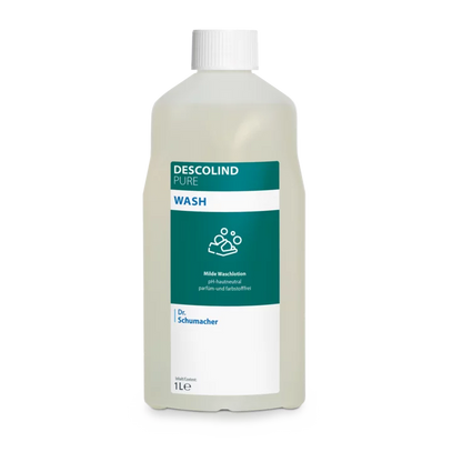 Dr. Schumacher Descolind Pure Wash Waschlotion der Dr. Schumacher GmbH in einer 1-Liter-Kunststoffflasche, pH-neutral und parfümfrei für empfindliche Haut, mit weißer Kappe und grün-weißem Etikett mit Produktinformation und Handwaschsymbol.