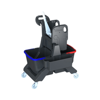 The Arcora Ecoblack 45 Double Mop Bucket from Arcora International GmbH is a mop bucket set on wheels made from 97% recycled material and equipped with blue and red compartments for efficient cleaning, as well as a built-in wringer and a handle.