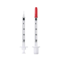 Two transparent syringes with measurement markings are shown vertically. One of them, a B. Braun The Omnican® 20 disposable insulin syringe has a red cap on one needle, while the other is open. Both have white plungers and are marked on their barrels with numbers from 0 to 100 to allow for precise dosing of U-40 insulin.