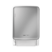 The CWS PureLine Dry from CWS is a silver, wall-mounted dispenser with a small logo near the base. It dispenses single sheets of white paper towels and promotes hygiene with its simple, sustainable design against a plain background.
