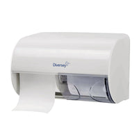 A white, wall-mounted horizontal double toilet paper holder from Diversey Deutschland GmbH & Co. OHG, featuring the brand name on the front, displays one visible roll of toilet paper and a hand towel—ideal for any bathroom.