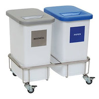 Two white bins labeled "General Waste" and "Paper" stand side by side on the Novocal Materia dual-bin recycling collection chassis, ensuring efficient waste separation.