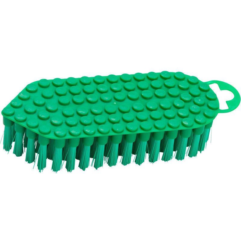 The Haug Bürsten KG FLEXO-BRUSH, PBT ø 0.35MM MEDIUM (190x70x25 mm) is a green cleaning brush with stiff PBT bristles, a textured top with raised circular elevations, and a small handle with an oval opening at one end.