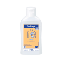 A bottle of Hartmann Stellisept® med antimicrobial wash lotion with a blue-and-orange label featuring symbols and text, including a hand and a drop, indicating its intended use.