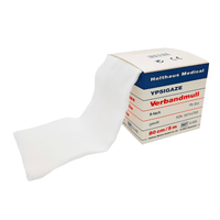 A package of Holthaus Ypsigaze gauze in various sizes from Holthaus Medical GmbH & Co. KG contains partially unrolled white gauze made of 100% cotton. The label indicates that the gauze is 80 cm wide and 5 meters long, along with various product codes and specifications.