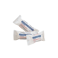 Three sterile medical gauze bandages in white packaging labeled “Holthaus Medical GmbH & Co. KG.” The packaging indicates, through blue and red text, that these are Holthaus Ypsisave bandage packs, 6 x 8 cm, small. These bandages are neatly arranged on a white background.