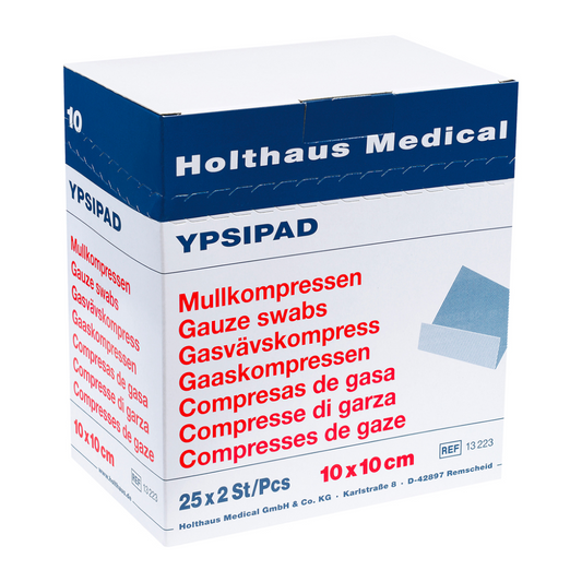 Eine Schachtel Holthaus Medical YPSIPAD Mullkompresse Mulltupfer, mit Etiketten in mehreren Sprachen, darunter Englisch und Deutsch, mit der Angabe der Größe von 10x10 cm
