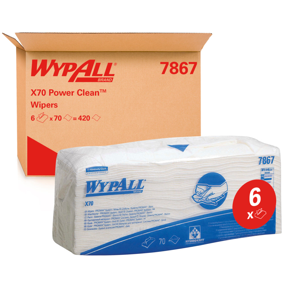 Eine Packung WypAll® X70 Wischtücher - gefaltet / Weiß (6 Beutel x 70 Tücher) der Kimberly-Clark GmbH ist vor einem Karton mit der Aufschrift "WypAll 7867" abgebildet. Das rote "6x"-Etikett hebt die Reinigungstücher in Industriequalität mit blauem Branding hervor.