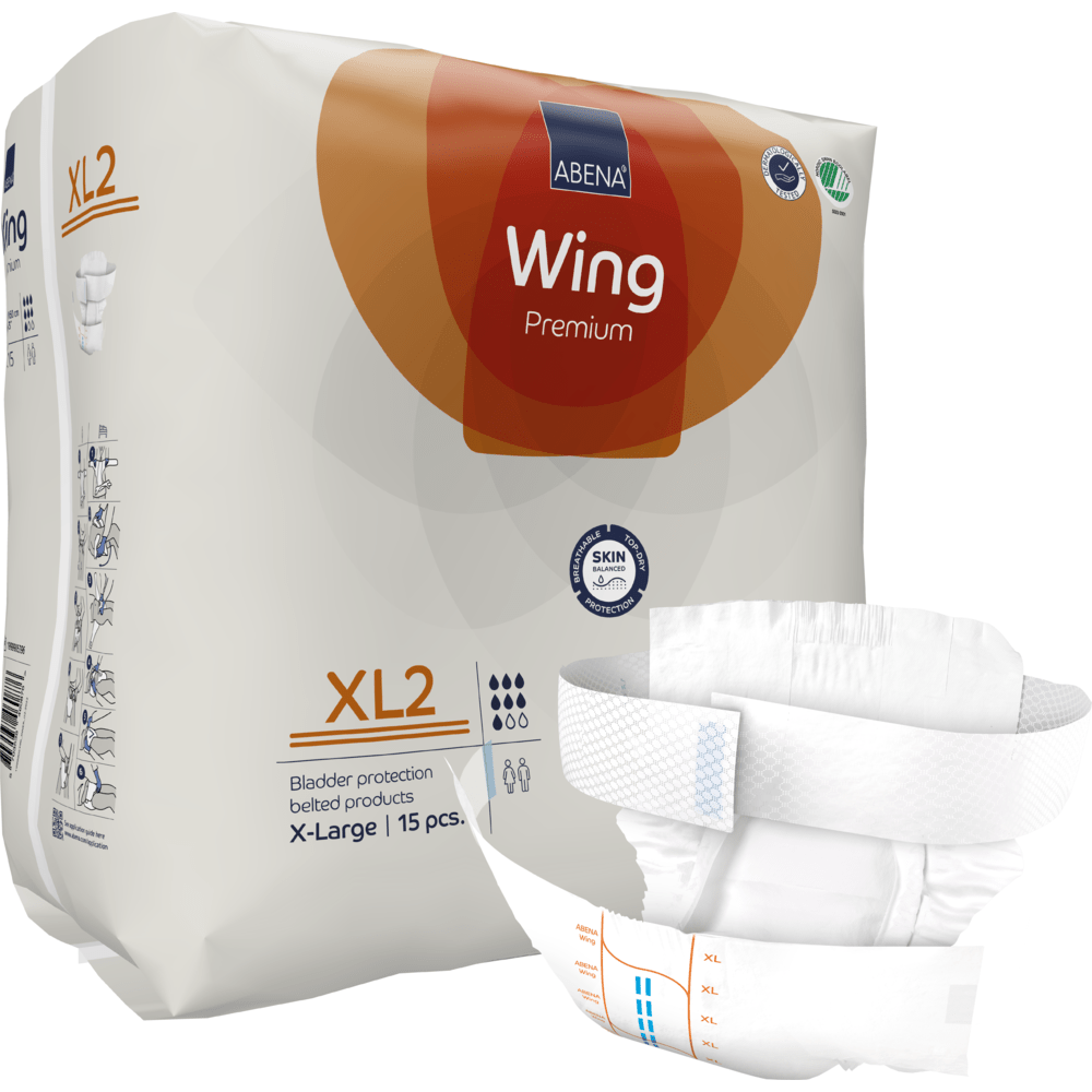 L'image montre un paquet de couches pour adultes ABENA Wing Premium d'Abena Re-Seller GmbH avec une couche XL2 dépliée à l'avant. Le paquet contient 15 produits d'incontinence en taille X-Large avec ceinture, offrant protection et confort.