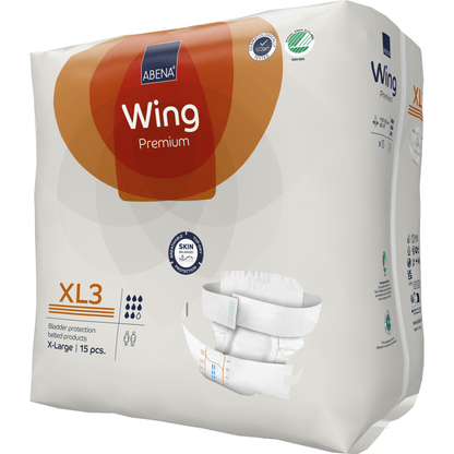 Un paquet de couches pour adultes ABENA Wing Premium de Abena Re-Seller GmbH (15 pièces) est livré dans un emballage principalement blanc avec des accents orange et marron, avec une protection ultime et des détails de taille détaillés.