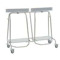 The Novocal "Genius" dual-compartment waste collector features a stainless steel frame with four swivel casters, two white platforms, and top rails—ideal for efficient waste separation. All pipe joints are seamlessly welded.