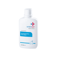 A white plastic bottle of Schülke Octenisan skin wash from Schülke & Mayr GmbH with a flip-top cap. The label, accented in blue, describes the antiseptic skin cleansing solution for medical facilities.