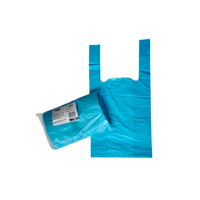 A roll of blue Seni-A waste bag from TZMO Deutschland GmbH labeled “HDPE 5 liters” and “odor-neutralizing” lies next to an unfolded bag. The unfolded bag, which is intended to be used as a waste bag, has two handles and a rectangular shape on a plain white background.